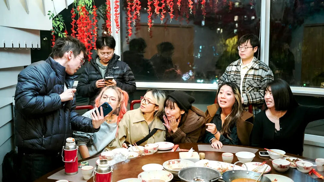 Group of friends gathered around a table for a meal.