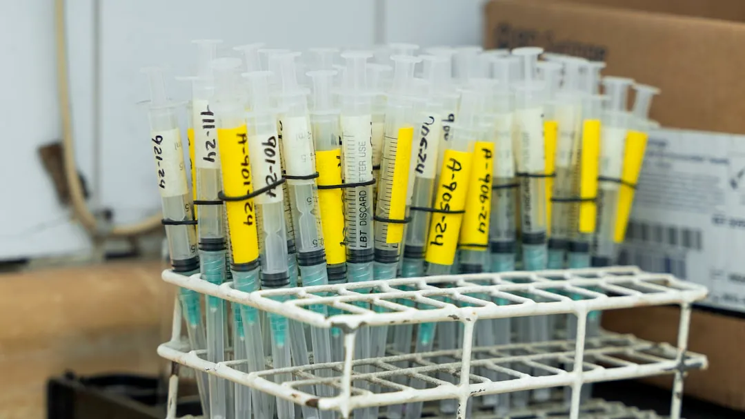 A rack filled with test tubes sitting on top of a table
