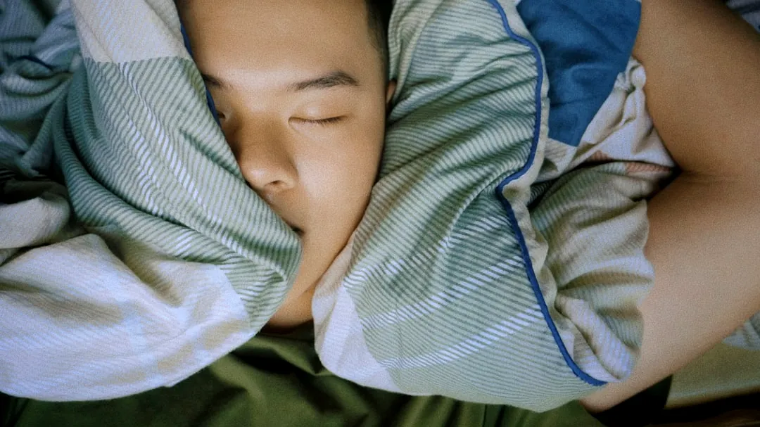 baby in blue and white stripe onesie