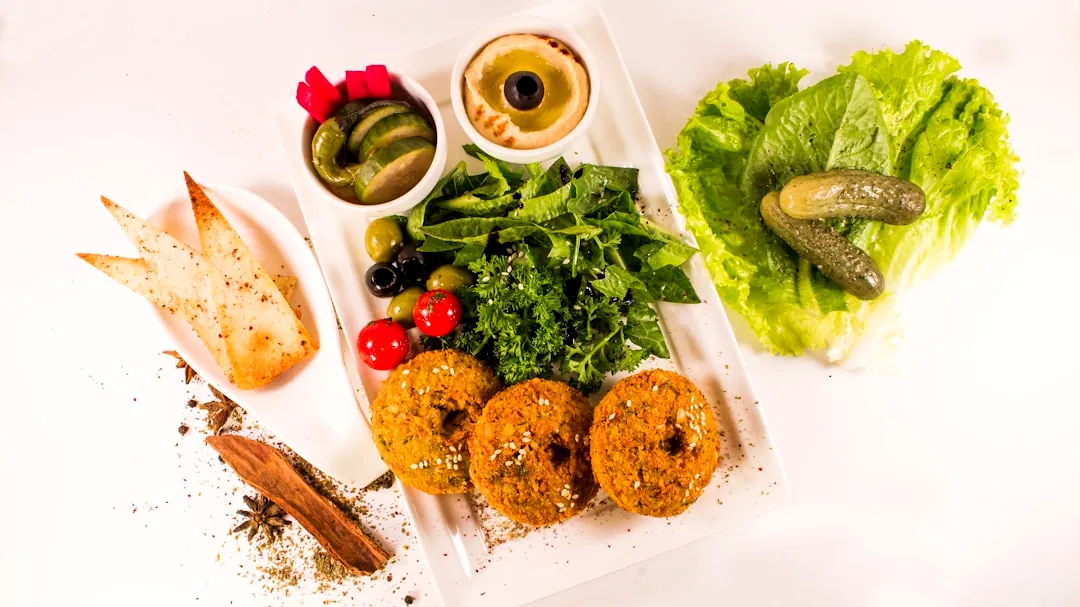 Falafel with hummus, salad, pickles, and bread