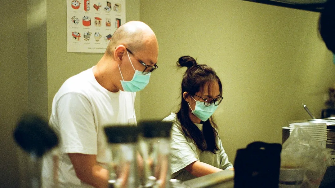 man in white crew neck t-shirt wearing black sunglasses