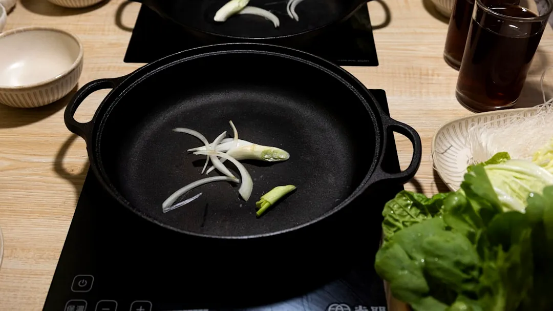 Onions and garlic slices in a hot pot