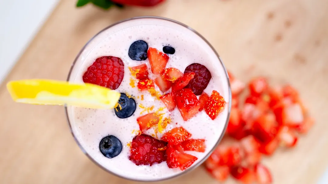 red strawberries on white ceramic bowl