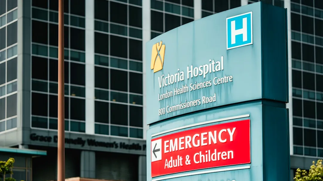 Victoria hospital emergency entrance sign with building
