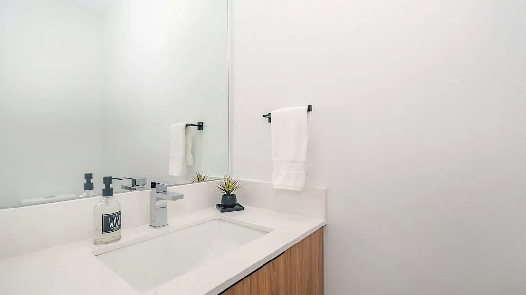 white ceramic sink with faucet