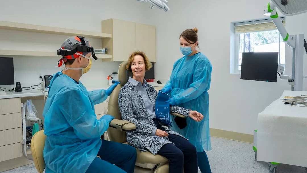 A group of people in a dental room